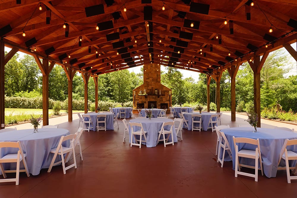 Tables all set for a wedding in the pavilion