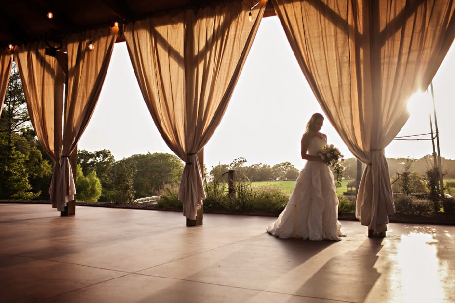 Wedding photos in front of the outdoor fireplace